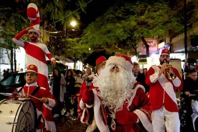 Festive procession along Hamra Street in Beirut, which hosts seasonal markets and concerts. AFP