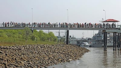 Rohingya refugees prepare to board a Bangladeshi naval vessel to be transported to Bhashan Char in the Bay of Bengal. AP