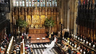 WINDSOR, UNITED KINGDOM - MAY 19: Prince Harry and Meghan Markle exchange vows during their wedding ceremony in St George's Chapel at Windsor Castle on May 19, 2018 in Windsor, England. (Photo by Owen Humphreys - WPA Pool/Getty Images)