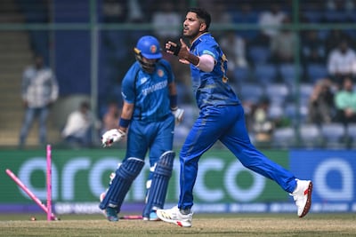 UAE's Junaid Siddique celebrates after taking the wicket of Afghanistan's Darwish Rasooli. AFP