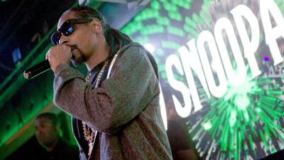 The controversial Snoop Dogg has been quietly involved in children's development through sports. Tyler Curtis / AP Photo