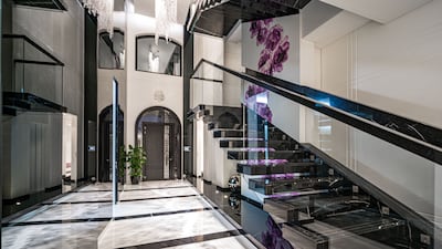 The triple-height foyer.