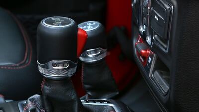 Willys Jeep outline logos are dotted all around the car, including on the gear-knob. Jeep