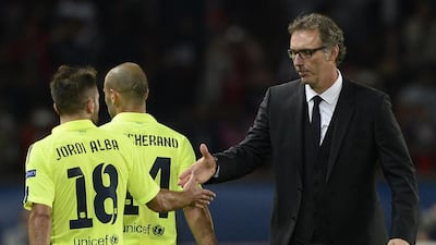 PSG coach Laurent Blanc, right, knows the culture well at Barcelona as a former teammate will be in the other dugout on Wednesday night. Franck Fife / AFP