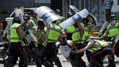 A demonstrator is arrested by riot police while rallying against Venezuela’s President Nicolas Maduro’s government in Caracas, Venezuela. Carlos Garcia Rawlins / Reuters