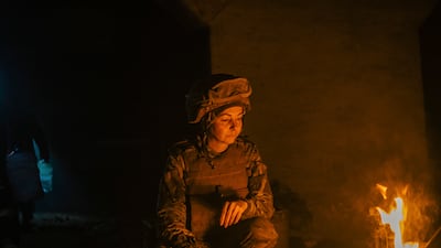 In this photo provided by Azov Special Forces Regiment of the Ukrainian National Guard Press Office, A Ukrainian woman soldier inside the ruined Azovstal steel plant take a rest in his shelter in Mariupol, Ukraine, May 10, 2022. For nearly three months, Azovstal’s garrison clung on, refusing to be winkled out from the tunnels and bunkers under the ruins of the labyrinthine mill. A Ukrainian soldier-photographer documented the events and sent them to the world. Now he is a prisoner of the Russians. His photos are his legacy. (Dmytro Kozatski / Azov Special Forces Regiment of the Ukrainian National Guard Press Office via AP)
