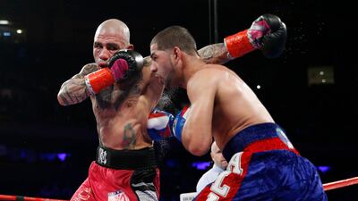 Miguel Cotto, left, and Sadam Ali exchange punches during their fight at at Madison Square Garden. Noah K. Murray / USA Today