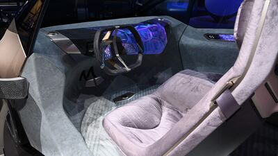 The interior of the BMW i Vision Circular concept car has seats that are designed to resemble lounge chairs. AFP