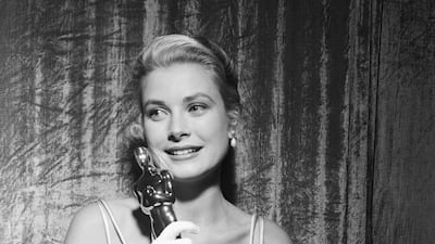 Grace Kelly clutches her Oscar at the 1954 awards after winning Best Actress for The Country Girl