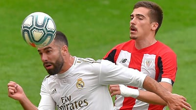 Real Madrid defender Daniel Carvajal challenges Athletic Bilbao's Inigo Cordoba. AFP