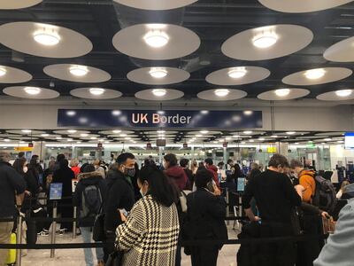 People queue at Terminal 5 of Heathrow Airport. Pia Josephson via Reuters