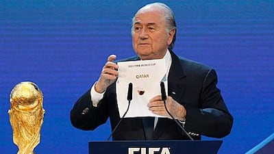 The Fifa president Sepp Blatter opens the envelope to announce Qatar's remarkable victory in the 2022 World Cup bidding.