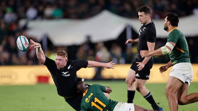 New Zealand's Fletcher Newell is tackled by South Africa's Makazole Mapimpi. AFP