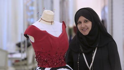 Itaf Adnan works on one of the dresses that will be shown during Fashion Fever Grand Prix this weekend. Ravindranath K / The National
