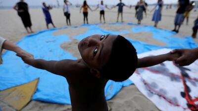 Climate change activists at Extinction Rebellion protests on a beach in Rio de Janeiro. Reuters