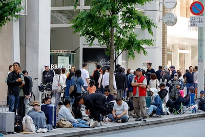 Customers queue outside the Swatch store in Ginza, Tokyo, to get their hands on the Royal Pop. EPA