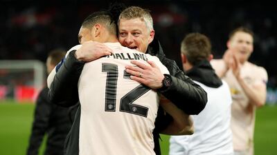 Manchester United interim manager Ole Gunnar Solskjaer and Manchester United's Chris Smalling celebrate. Reuters