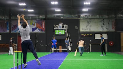 A group of men play indoor cricket at the Insportz Club in the Al Quoz area of Dubai. Christopher Pike / The National