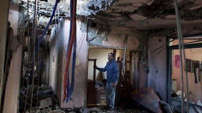 Hawaz Aziz in his family's destroyed apartment. The building was targeted by an Israeli airstrike. Heidi Levine for The National