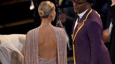 Brie Larson, left, speaks with Spike Lee in the audience at the Oscars on Sunday. AP