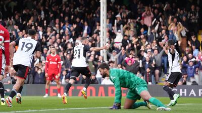 Fulham’s Timothy Castagne, centre, celebrates scoring their first goal. PA