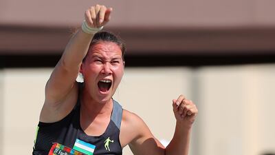 Mokhigul Khamdamova of Uzbekistan competes in the woman's Shot Put F57. EPA