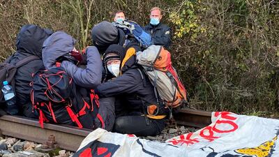 Activists block rail tracks before the arrival of a train transporting nuclear waste to the nuclear power plant in Biblis, Germany. Reuters