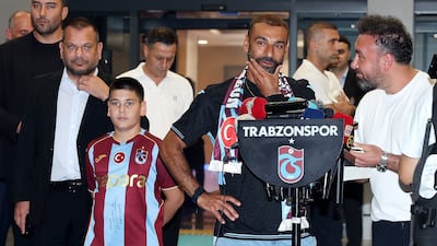Mohamed Salah is accompanied by Trabzonspor President Ertugrul Dogan as he arrives in the Black Sea city of Trabzon. Reuters