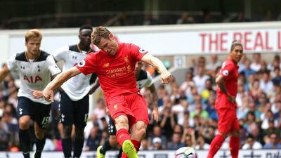 Liverpool midfielder James Milner scores from the penalty spot. Justin Tallis / AFP