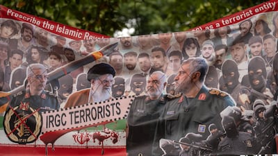 Iranian opposition banner near the Iranian embassy in London on Tuesday. Carl Court / Getty Images