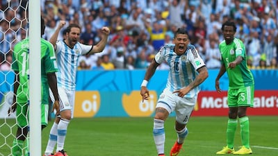 Marcos Rojo of Argentina celebrates scoring his team's third goal, the winner in a 3-2 victory over Nigeria on Wednesday at the 2014 World Cup in Porto Alegre, Brazil. Jeff Gross / Getty Images