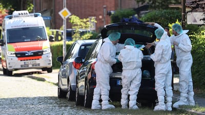Forensics officers comb the scene. AFP