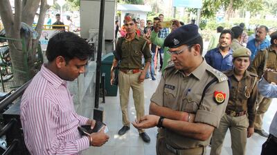 Police checking the identity of a man at Saharaganj mall as they run an anti-Romeo operation on March 22, 2017 in Lucknow, India. The anti-Romeo squads were formed by the police on order of Uttar Pradesh chief minister Yogi Adityanath fulfilling a pre-poll pledge to check on the harassment of women. Deepak Gupta/Hindustan Times via Getty Images