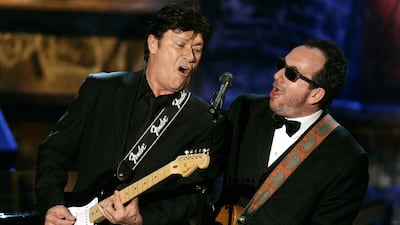 Robbie Robertson, left, with Elvis Costello in 2006. Reuters