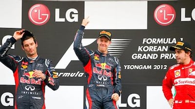 Red Bull's Sebastian Vettel celebrates his Korean Grand Prix win over Mark Webber and Fernando Alonso