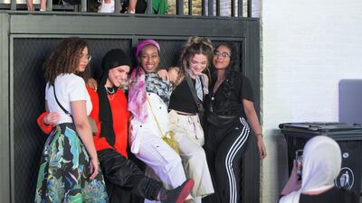 Visitors taking photos at Sole DXB at D3. Leslie Pableo for The National