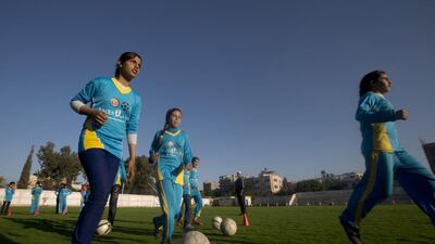 Palestinian girls tarining at the Beit Lahia football club in the northern Gaza strip as part of an after-school sport program funded by the Palestine Association for Children’s Encouragement of Sports. Mahmud Hams / AFP