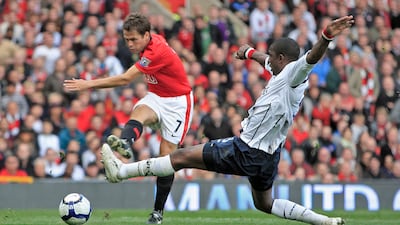 Michael Owen shoots during the 2009-10 season, when United finished as runners-up with 85 points. EPA