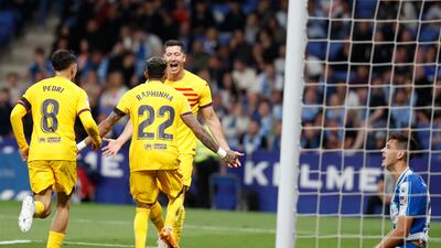 Barcelona's striker Robert Lewandowski (R) celebrates with his teammates after scoring the 0-3 goal during the Spanish LaLiga soccer match between RCD Espanyol and FC Barcelona, in Barcelona, Catalonia, Spain, 14 May 2023. EPA / Andreu Dalmau