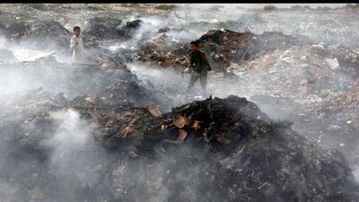 Young boys collect recyclables from a rubbish dump on the outskirts of Karachi, Pakistan. Akhtar Soomro / Reuters