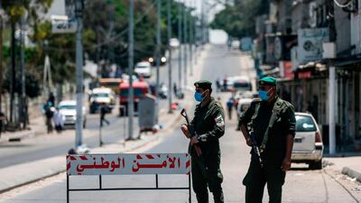 Palestinian security forces man a checkpoint in Gaza City as part of a mock lockdown to prepare for a possible outbreak of coronavirus the blockaded coastal territory. AFP