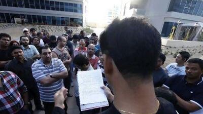 A Skycourts resident reads complaints to be submitted to the owners’ association.