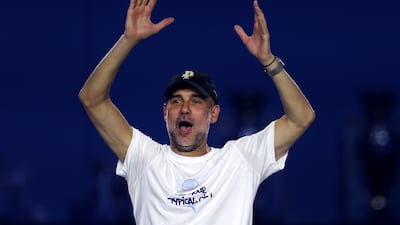 Pep Guardiola acknowledges the crowd on stage at The Co-op Live Arena in Manchester, England. Getty Images