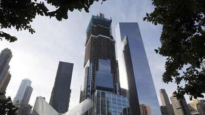 The World Trade Center Transportation Hub, lower left, and commercial office buildings 3 World Trade Center, center, and 4 World Trade Center, right, which are part of the rebuilt site, in New York. Mark Lennihan / AP