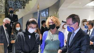 From left: Noura Al Kaabi, UAE Minister of Culture and Youth, Ida Zilio-Grandi, director of the Italian Cultural Institute, and Nicola Lener, Italy's ambassador to the UAE, attend the ribbon-cutting ceremony at the Diva! Italian Glamour in Fashion Jewellery exhibition. Khushnum Bhandari / The National