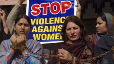Pakistani women chain themselves during a rally to condemn domestic violence in Multan.