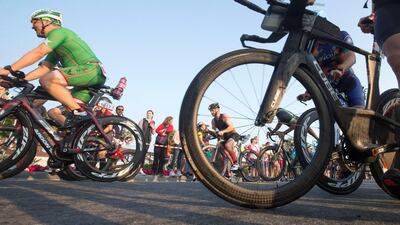 Competitors during the cycling section of Ironman Dubai on Friday. Leslie Pableo for The National