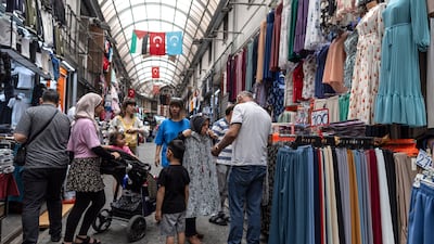 People shop at the Mahmutpasa bazaar in Istanbul, Turkey. The central bank has been raising interest rates since mid-2023 to bring down inflation. EPA