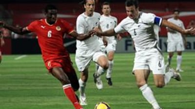 The New Zealand captain Ryan Nelsen, right, clears the ball ahead of Bahrain's Jaycee John on Saturday.
