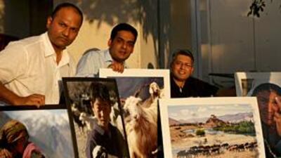 From left, Henry D'Silva, Shahid Hashmi and Sujin Balakumaran display work that will be part of an exhibition in the US.